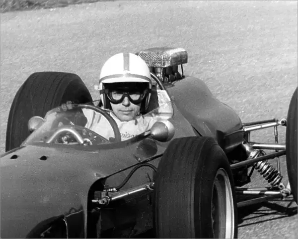 After his accident world famous auto racer John Surtees has stepped into a racing