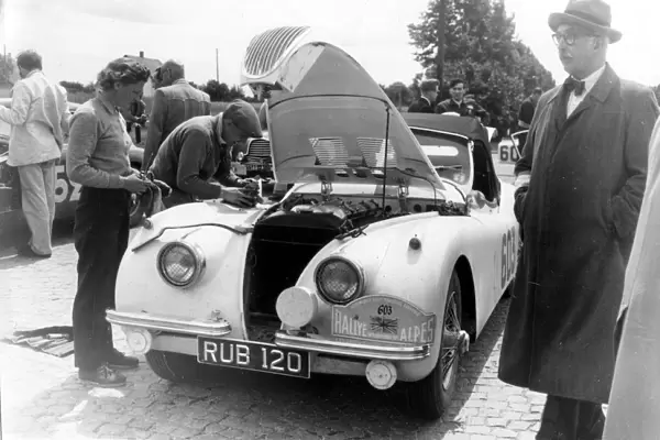 Munich: British driver Ian Appleyard services his Jaguar car at the Munich check