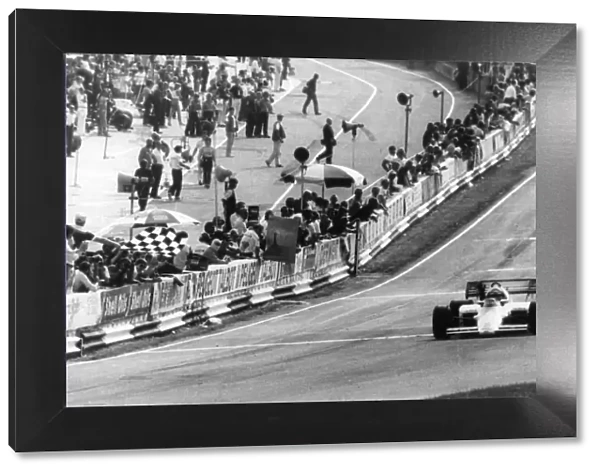 Brands Hatch, July 21st Austrias Niki Lauda takes the chequered flag to win the