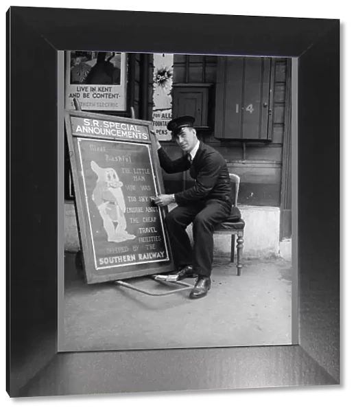 Railway porter sign writer Mr E A Burgar. 1938