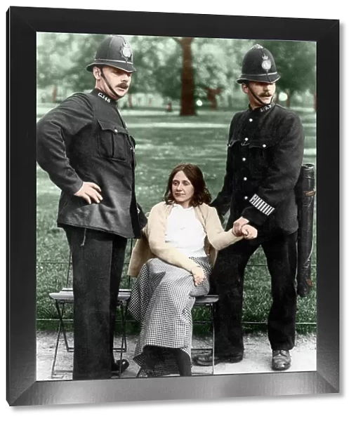 Votes for Women - policemen with a suffragette arrested in Hyde Park about 1912 Colourised
