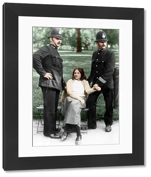 Votes for Women - policemen with a suffragette arrested in Hyde Park about 1912 Colourised