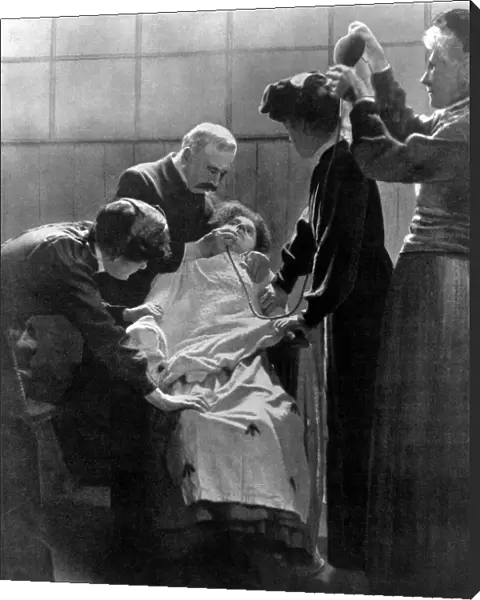 A woman Suffragette prisoner being force fed with a tube 1912