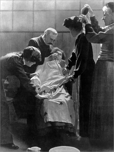 A woman Suffragette prisoner being force fed with a tube 1912