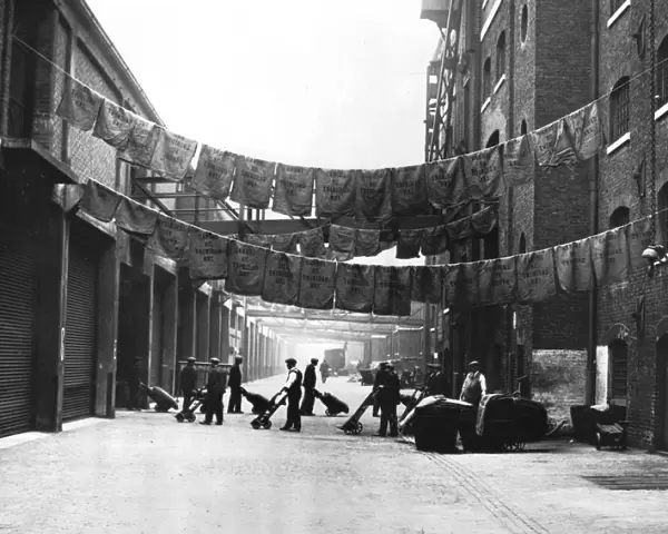 Sugar bags hanging out to dry, North Quay, West India Docks, 1900