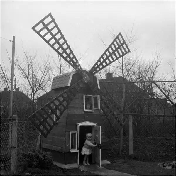 Five-year-old Denise Holmes and her sister Nicola, two, now have a windmill at