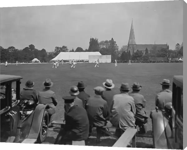 Horsham cricket week in progress, with Horsham church in background