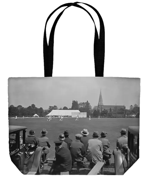 Horsham cricket week in progress, with Horsham church in background