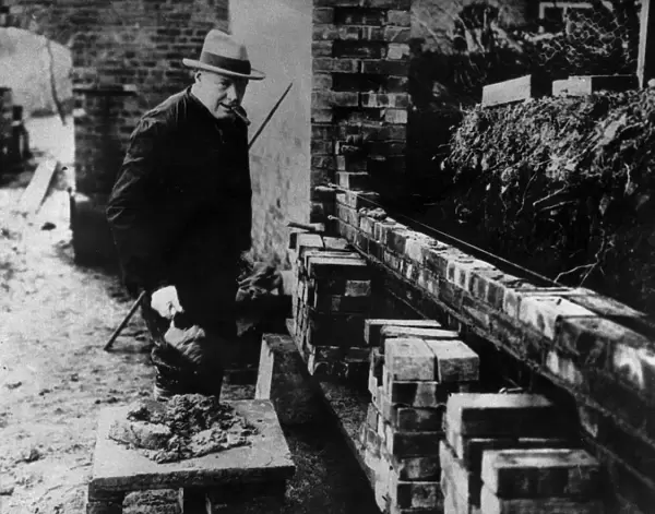 Winston Churchill building a wall at his house Chartwell near Westerham Kent. At