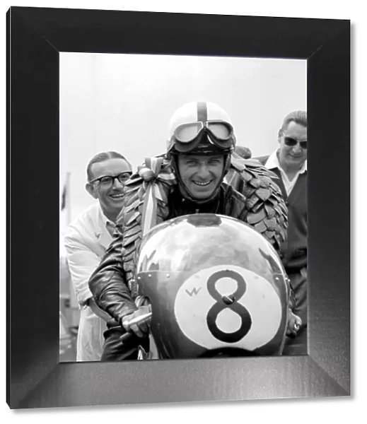 Brands Hatch, Kent: German Motor cycle racing ace, Ernst Degner has a smile of victory