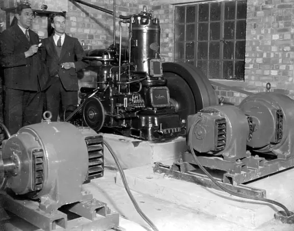 Generators at the Commodore Cinema, Orpington, Kent in the 1930s, with cinema staff looking
