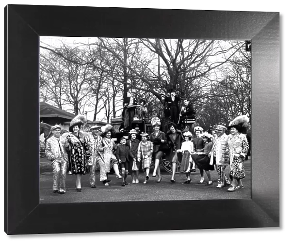 The annual Easter Sunday Parade - at Battersea Park, London. A crowd including Pearly Kings