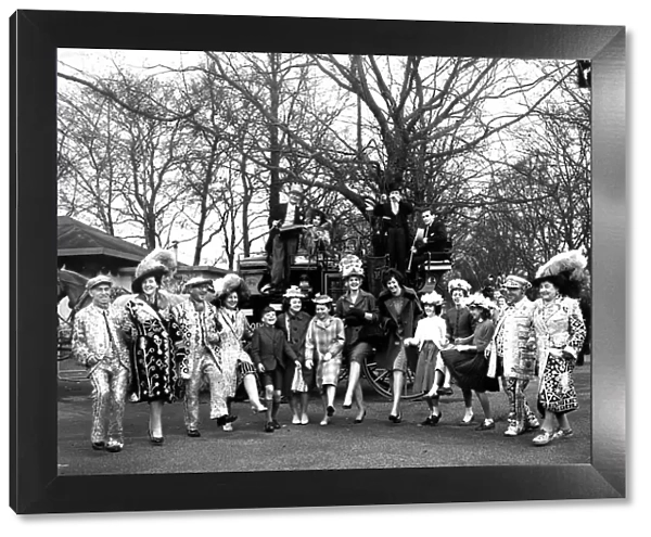 The annual Easter Sunday Parade - at Battersea Park, London. A crowd including Pearly Kings