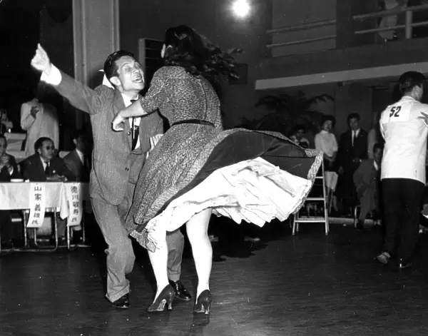 Couple energetically Dancing jive or jitterbug 1950s dance  /  dancing  /  party