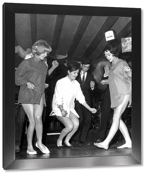 These three young ladies are practicing the newest dance craze, The Twist, while