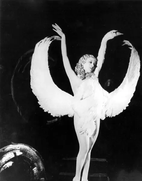 Sally Rand of Fan Dance fame is shown in one of the positions in her new dance which