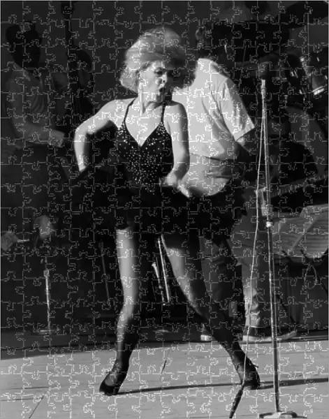 Joey Heatherton, entertains American servicemen with a torrid dance during the troops