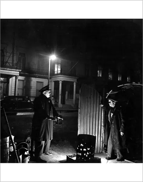 29 March 1952 Bill Howard a Romany night watchman in Belgrave Square, talking to