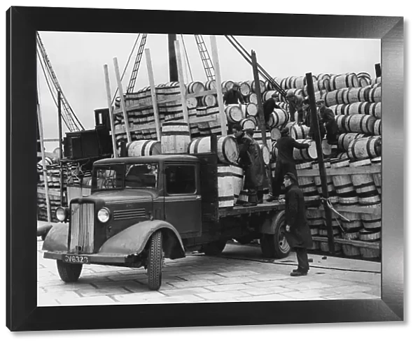 Barrels for the Shetland catch of herring being unloaded at Lerwick, 1949