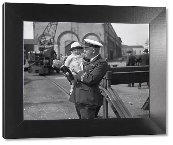 22 month baby Louise Passmore in the arms of Captain Lock on arrival at Southampton
