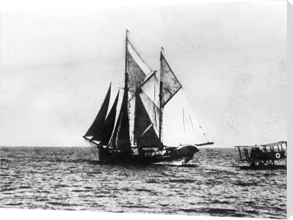 A German seaplane comes down on the water to stop a British sailing ship. 1914 - 1918