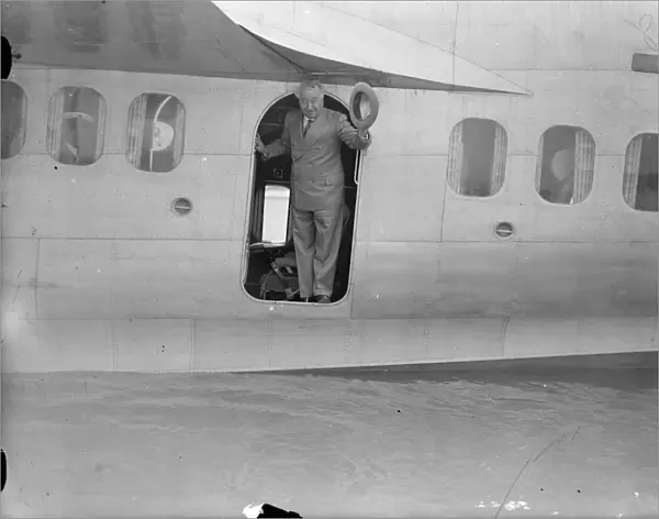 Australian Premier, leaves for Holland by flying boat on way home. Mr J A Lyon s