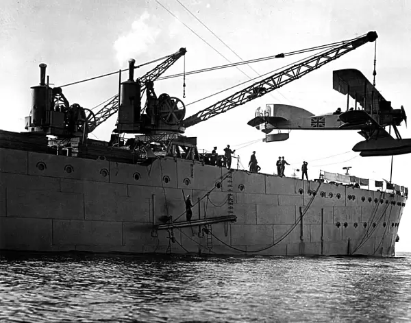 Hoisting out a seaplane from British seaplane carrier HMS Ark Royal, Mudros