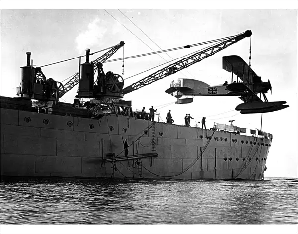 Hoisting out a seaplane from British seaplane carrier HMS Ark Royal, Mudros