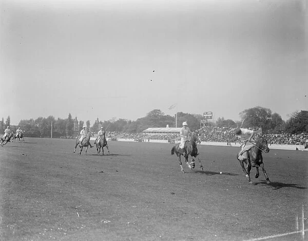 10, 000 watch Anglo American trial Polo Captain Traill taking the ball from Mr C C Runsey