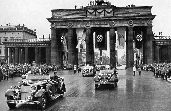 1936 Olympics, Berlin - Adolf Hitler in an open top car leading a fleet of cars through