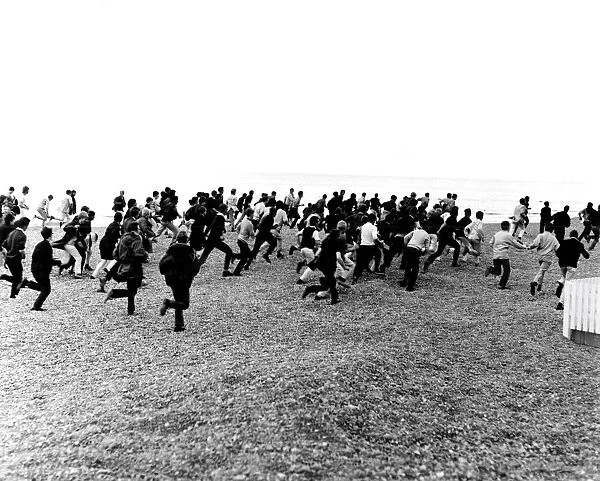 1964. Hastings. Mods and Rockers clash. 3rd August. Racing along the beach