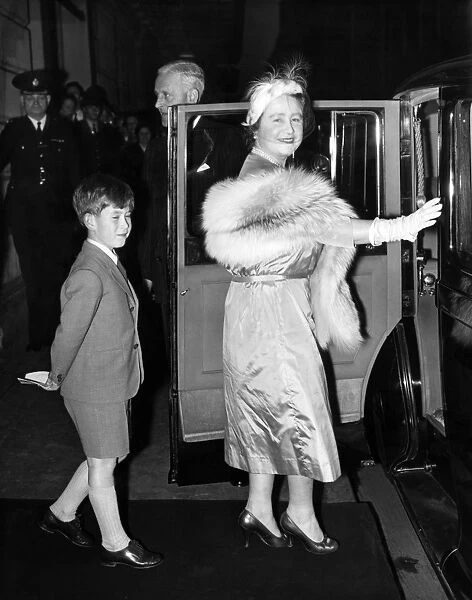 20 October 1956 Prince Charles follows the Queen Mother to their car after watching