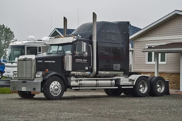 A 6 x4 western star tractor unit parked on the owners front drive in rural Ontario Canada