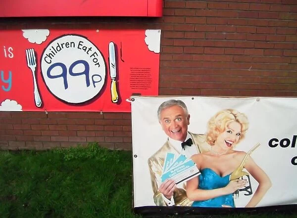 Advertisements to lure customers of all ages, motorway service station brick wall with posters