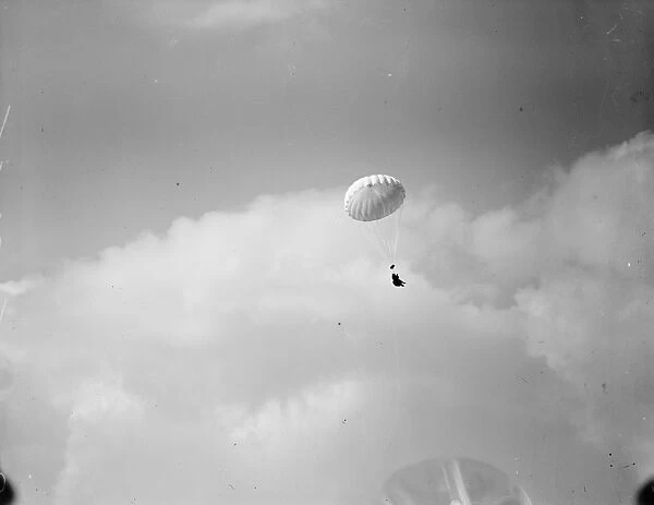 Aerial Derby at Hendon on July 5th Parachutist hanging from their chute 21 June 1919