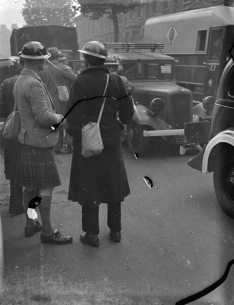 Air Raid Precaution exercise on Old Kent Road in London. A kilted man is amongst