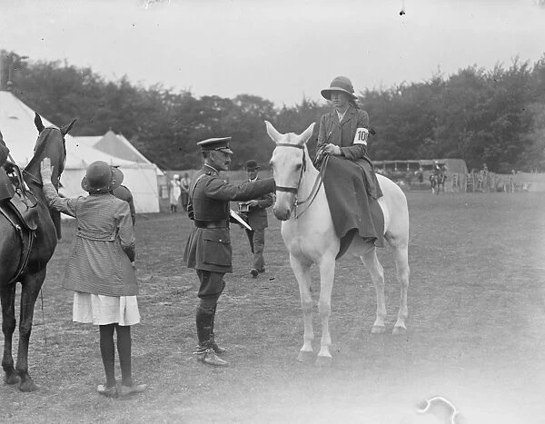 At the Aldershot Horse Show, Major General Sir EG Bainbridge talks to one of the