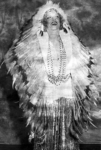 Americas Night Club Queen dons feathers. Texas Guinan, the famous night club