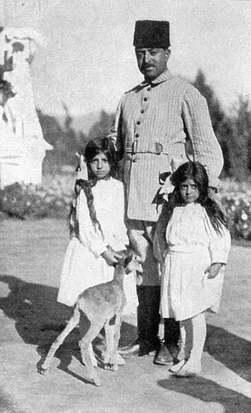 The Amir of Afghanistan photographed with his two daughters. 12 March 1928
