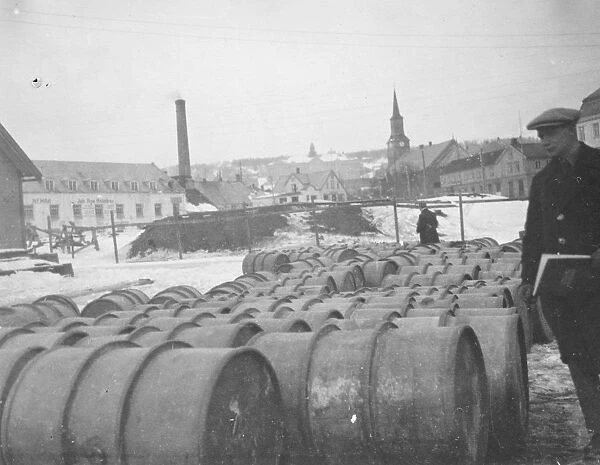 Amundsen Ellsworth Polar Flight Petrol barrels on the quay at Narvik. They contain