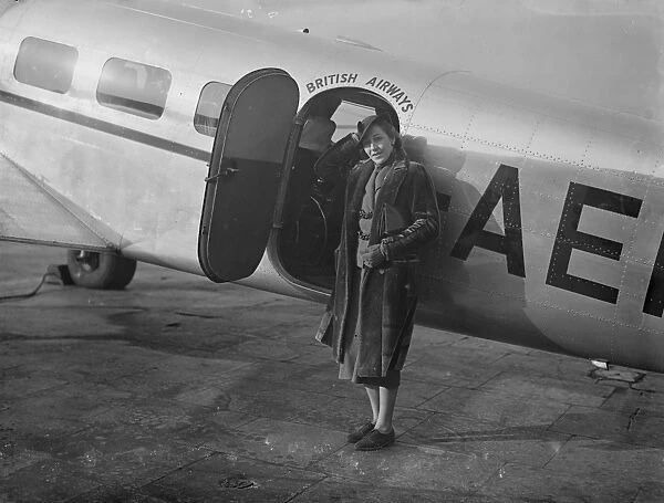Amy Johnson flies to Paris. Taking up car racing. Miss Amy Johnson, who is now