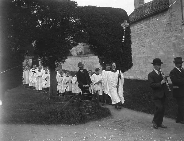 The ancient ceremony of Clipping the yew trees at Painswick, Gloucester. Parading