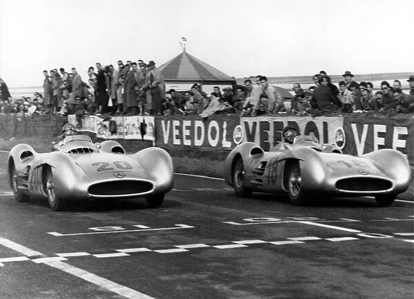 Argentines car ace Juan Manuel Fangio (number 18) and German driver Karl Kling (20)