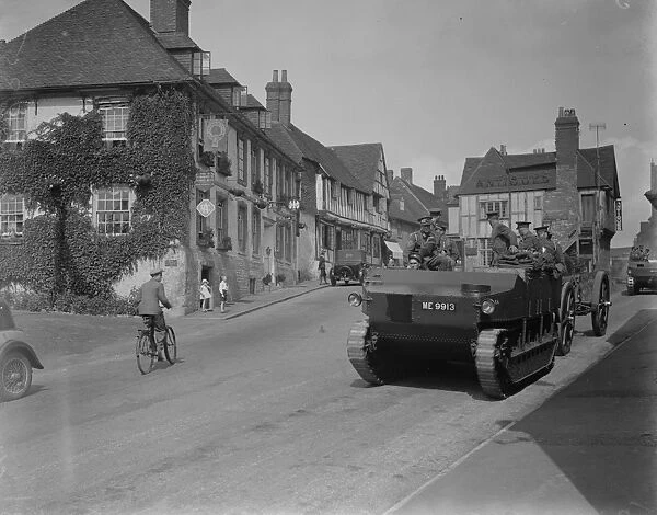The army manoeuvres. Mechanised heavy artillery passing through picturesque Midhurst