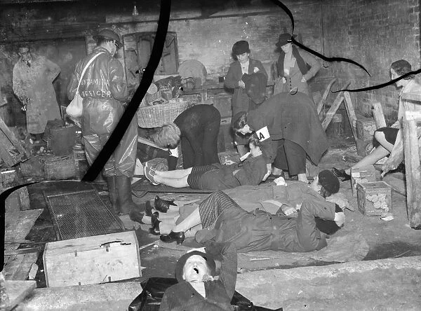 ARP ( Air Raid Precautions ) wardens examines the casualties during a drill in Sidcup
