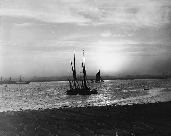 Barges on the River Thames off Long Reach, near Dartford, Kent. January 1938