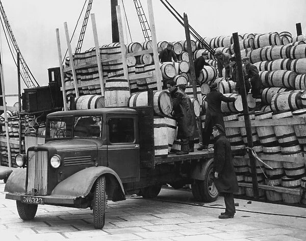 Barrels for the Shetland catch of herring being unloaded at Lerwick, 1949