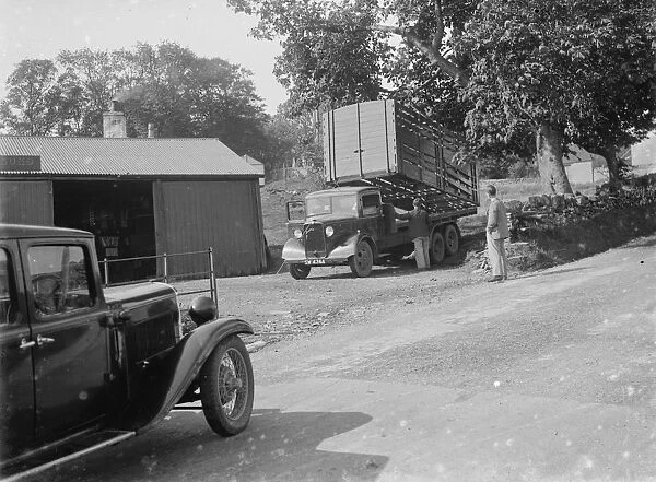 Bedford lorry in Borgue, offloads its load. 1935