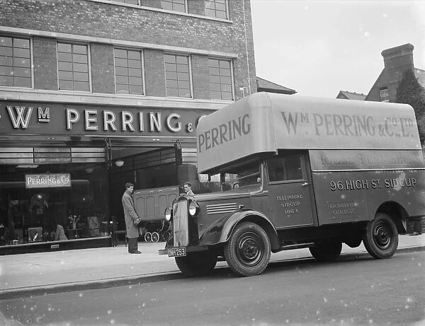 A Bedford truck belonging to W Perring and Co Ltd, the house furnishers. Workers