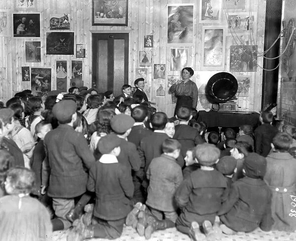 Belgians taught English at the Poland Street refuge by means of a gramophone. 1914